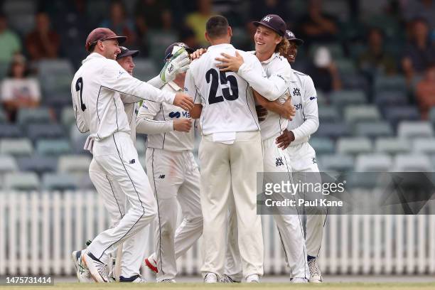 Scott Boland and Campbell Kellaway of Victoria celebrate the wicket of Cameron Bancroft of Western Australia during the Sheffield Shield Final match...
