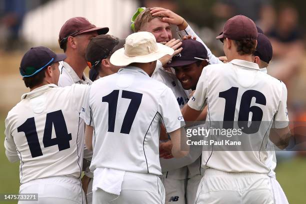Will Sutherland and Ashley Chandrasinghe of Victoria celebrate the wicket of Teague Wyllie of Western Australia during the Sheffield Shield Final...