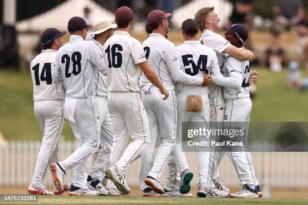 Will Sutherland and Ashley Chandrasinghe of Victoria celebrate the wicket of Teague Wyllie of Western Australia during the Sheffield Shield Final...