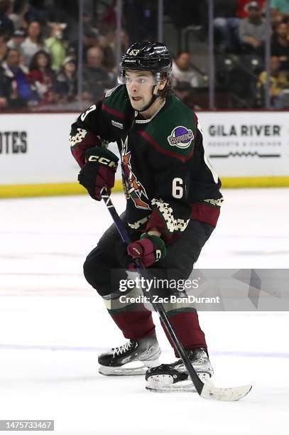 Matias Maccelli of the Arizona Coyotes skates with the puck against the Calgary Flames at Mullett Arena on March 14, 2023 in Tempe, Arizona.