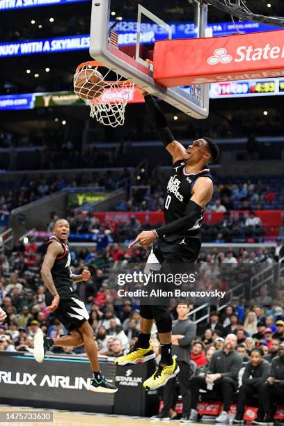 Russell Westbrook of the Los Angeles Clippers dunks the ball during the game against the Oklahoma City Thunder at Crypto.com Arena on March 23, 2023...