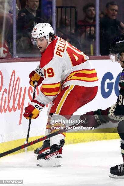 Jakob Pelletier of the Calgary Flames makes a pass against the Arizona Coyotes at Mullett Arena on March 14, 2023 in Tempe, Arizona.