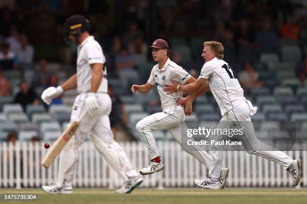 Mitch Perry and Will Sutherland of Victoria celebrate the wicket of Hilton Cartwright of Western Australia during the Sheffield Shield Final match...