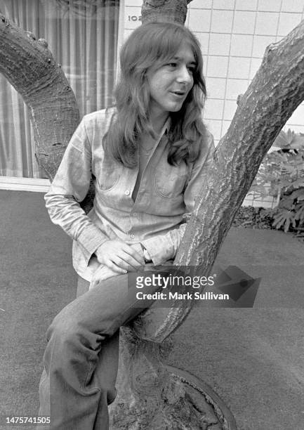 Musician Mick Ralphs poses outside his room at the Beverly Hilton Hotel in Beverly Hills, CA 1976.