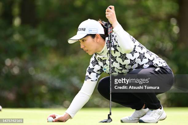 Ritsuko Ryu of Japan lines up a putt on the 13th green during the first round of AXA Ladies Golf Tournament in Miyazaki at UMK County Club on March...
