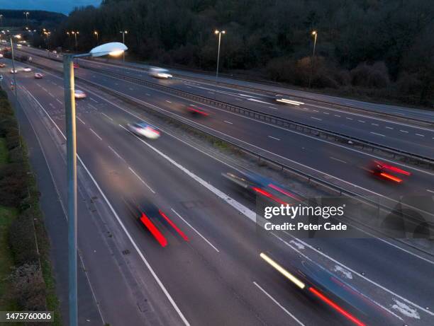 blurred cars driving along motorway - southwest england stock pictures, royalty-free photos & images