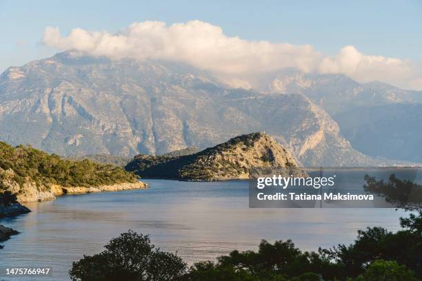 blue sea with islands landscape. clouds in mountains. - aegean turkey stock pictures, royalty-free photos & images