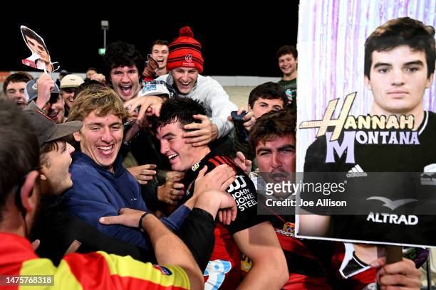Jamie Hannah of the Crusaders celebrates with his friends following the round five Super Rugby Pacific match between Crusaders and ACT Brumbies at...