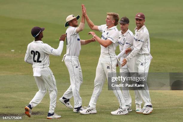 Will Sutherland of Victoria celebrates the wicket of Aaron Hardie of Western Australia during the Sheffield Shield Final match between Western...