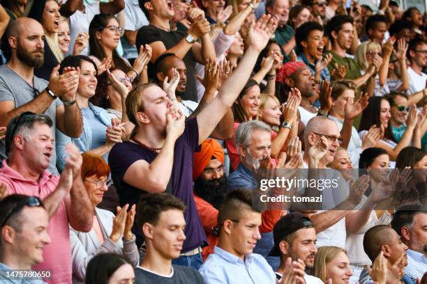 whistling on fingers at the match - arena crowd stock pictures, royalty-free photos & images