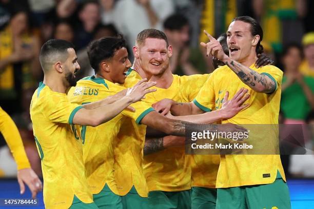 Jackson Irvine of the Socceroos celebrates with his team mates after scoring a goal during the International Friendly match between the Australia...