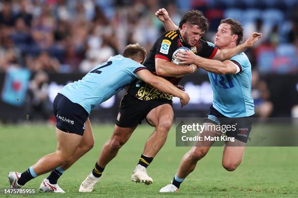 Alex Nankivell of the Chiefs is tackled during the round five Super Rugby Pacific match between NSW Waratahs and Chiefs at Allianz Stadium, on March...