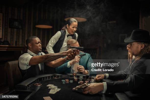 gangster gun violence at the poker table - female gangster stock pictures, royalty-free photos & images