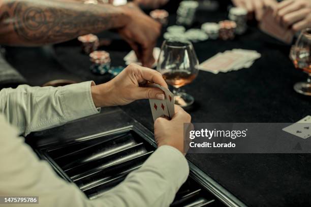 poker evening for friends in a brown bar - gambling table 個照片及圖片檔