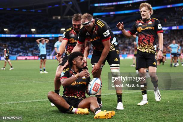 Emoni Narawa of the Chiefs celebrates with team mates after scoring a try during the round five Super Rugby Pacific match between NSW Waratahs and...