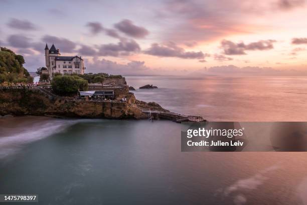 villa belza at port vieux in biarritz during sunset - biarritz stock-fotos und bilder
