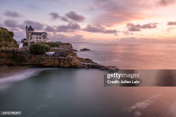 villa belza at port vieux in biarritz during sunset - biarritz stock pictures, royalty-free photos & images