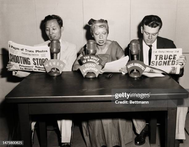 In three different languages, word of the armistice signing in Korea and cease-fire go out to the world from the studio of the Voice of America at...