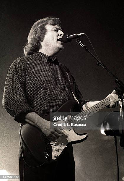 English musician David Gilmour, of the group Pink Floyd, performs in concert, New York, New York, circa 1984.