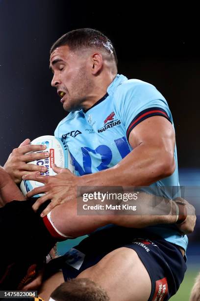 Izaia Perese of the Waratahs is tackled during the round five Super Rugby Pacific match between NSW Waratahs and Chiefs at Allianz Stadium, on March...