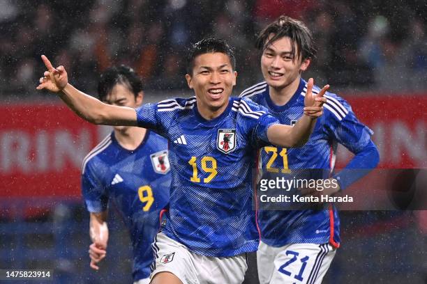 Takuma Nishimura of Japan celebrates after scoring the team's first goal during the international friendly match between Japan and Uruguay at the...