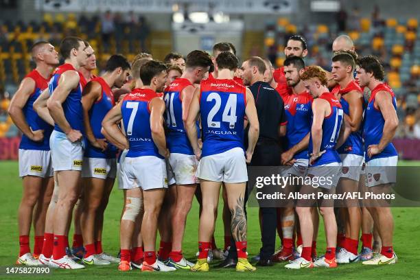 Melbourne Demons head coach Simon Goodwin speaks to players after their defeat during the round two AFL match between Brisbane Lions and Melbourne...