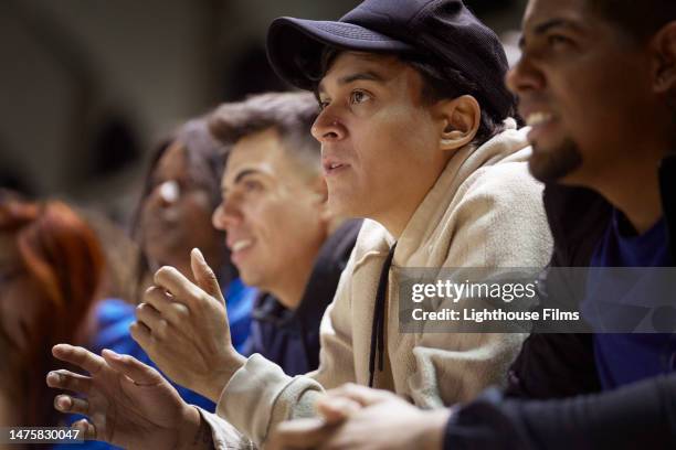 spectators watch events unfold on a field at a sporting event. - crowd anticipation stock pictures, royalty-free photos & images