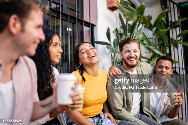 happy friends talking outdoors - weekend activities stock pictures, royalty-free photos & images