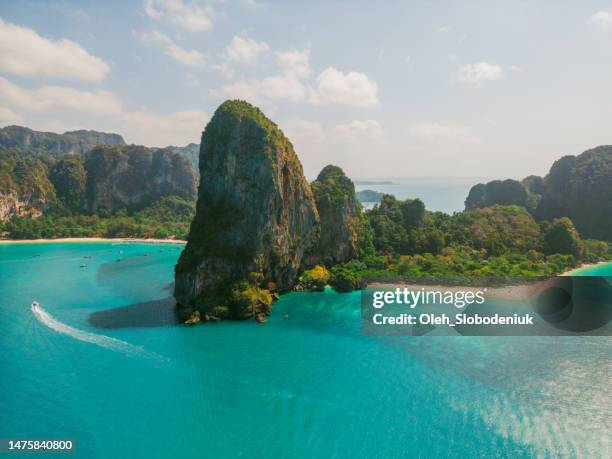 aerial view of speedboats near an island in andaman sea - railay strand stock pictures, royalty-free photos & images