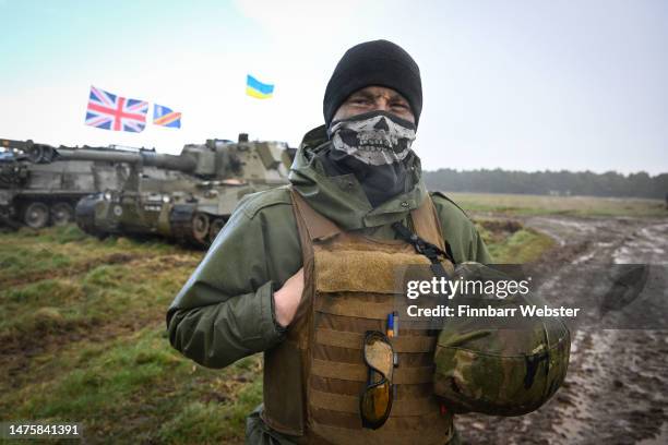 Ukrainian soldier is seen with flags of Ukraine and the United Kingdom during their final training, on March 24, 2023 in South West, England....