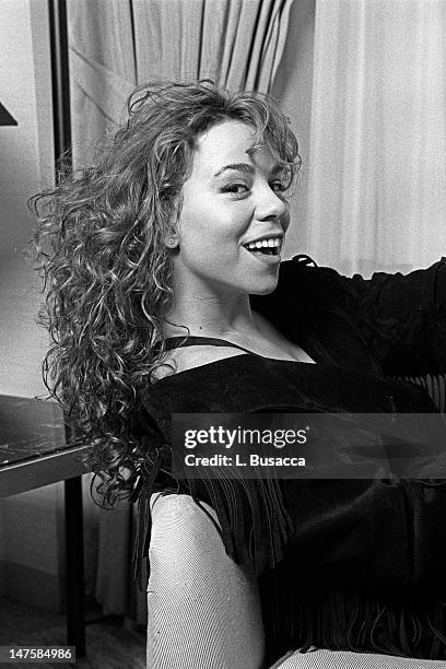 American vocalist Mariah Carey poses for photographs, New York, New York, circa 1991.