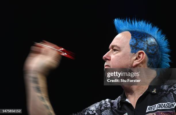 Peter Wright in throwing action during the quarter finals of the 2023 Cazoo Premier League Night Eight at Utilita Arena on March 23, 2023 in...