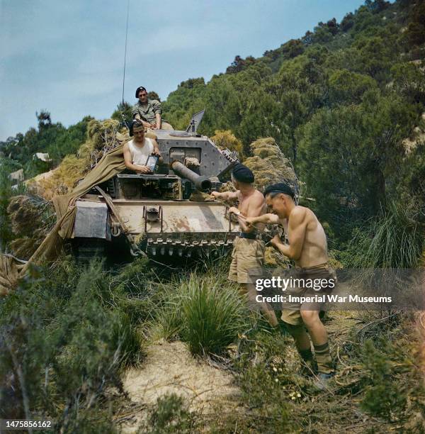 Sergeant Elms of 16/5 Lancers and his tank crew, El Aroussa, Tunisia, 1943: Trooper Bates, Royal Armoured Corps; with Signalman Bower, Royal Corps of...