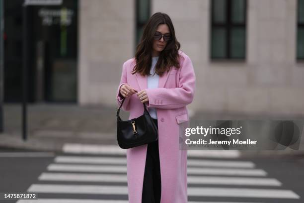Karla Jenders seen wearing A. Kjaerbede grey sunglasses with blue lenses, Yes My Love white top, Zara pink long coat, Review black wide leg denim...