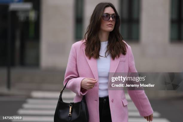 Karla Jenders seen wearing A. Kjaerbede grey sunglasses with blue lenses, Yes My Love white top, Zara pink long coat, Review black wide leg denim...