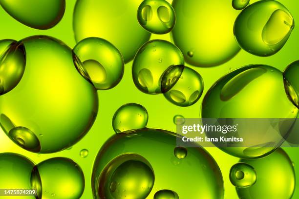 green molecules. 3d bubbles pattern. digital generated image. - oil flow stockfoto's en -beelden