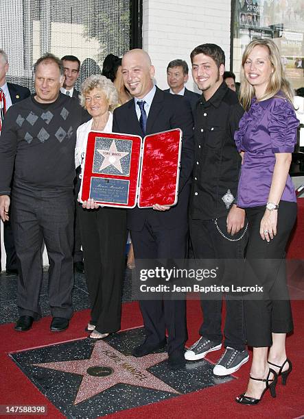 Comedian Howie Mandel and wife Terry Soil pose with Mandel's star on the Hollywood Walk of Fame on September 4, 2008 in Hollywood, California.