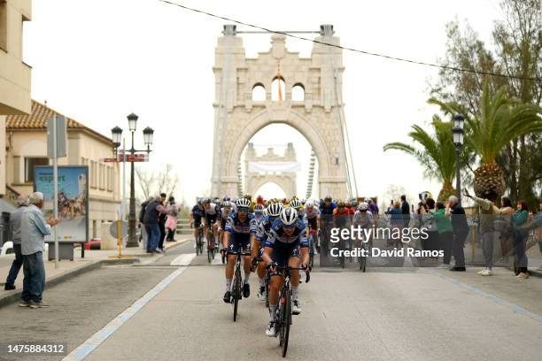 General view of Pieter Serry of Belgium and Team Soudal Quick-Step leads the peloton passing through the Penjant bridge in Amposta during the 102nd...
