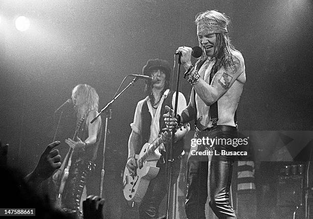 Duff McKagan and Axl Rose of Guns 'n' Roses perform in concert at the Ritz on February 2, 1988 in New York City