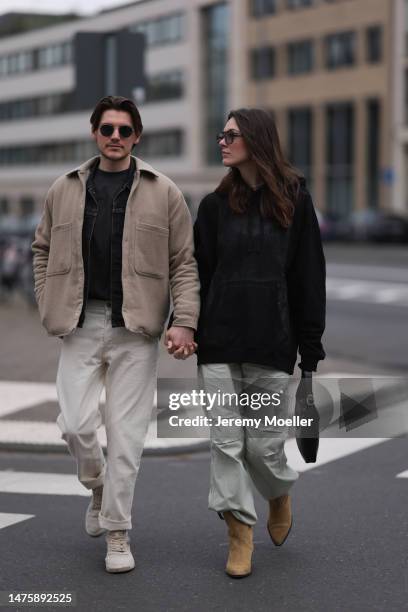 Mathis seen wearing Ray-Ban black sunglasses, Weekday grey cotton shirt, Weekday beige jacket, Weekday white denim pants, Copenhagen Studios white...