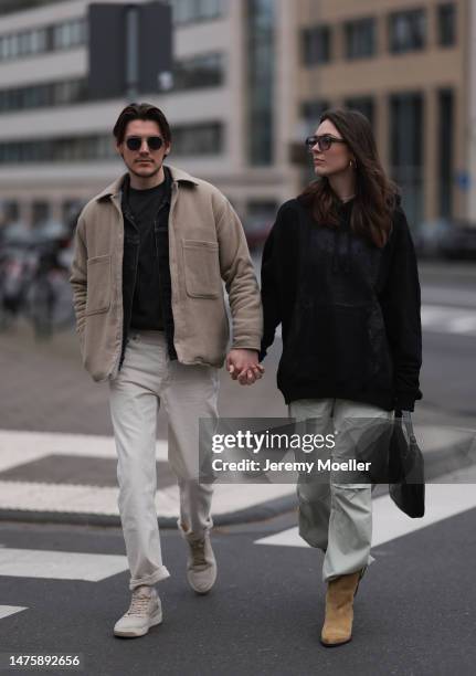 Mathis seen wearing Ray-Ban black sunglasses, Weekday grey cotton shirt, Weekday beige jacket, Weekday white denim pants. Karla Jenders seen wearing...