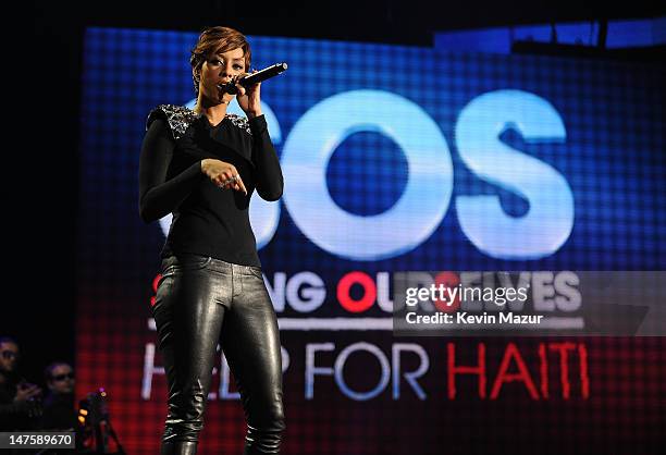 Musician Keri Hilson performs at the BET-SOS Saving Ourselves  Help for Haiti Benefit Concert at AmericanAirlines Arena on February 5, 2010 in...