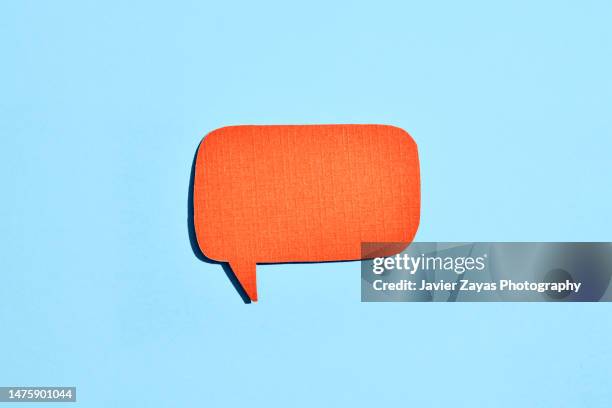 orange comic bubble on blue background - online chat bubble stock pictures, royalty-free photos & images