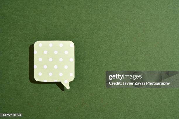 green comic bubble on green background - chat bubble stock pictures, royalty-free photos & images