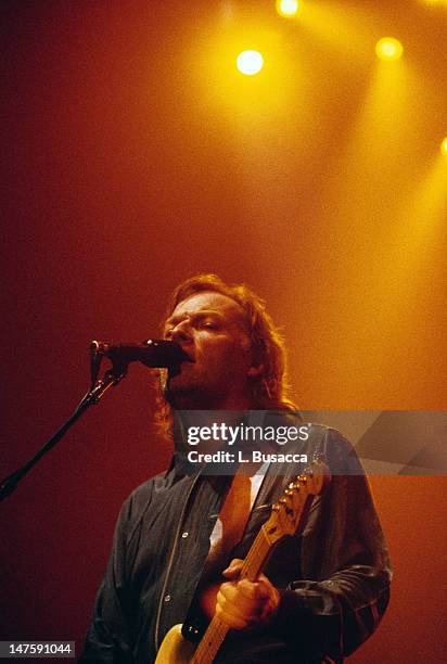 English musician David Gilmour, of the group Pink Floyd, performs in concert, New York, New York, circa 1984.