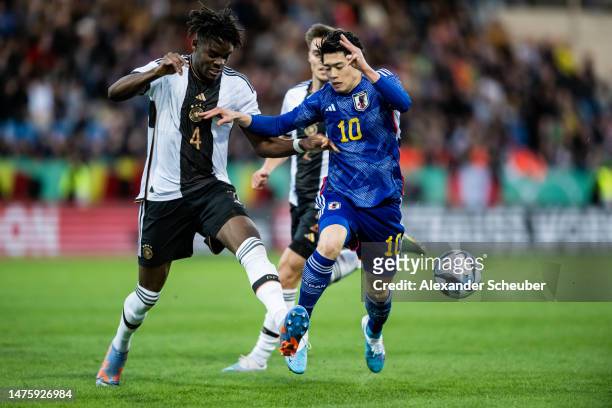 Yann Aurel Bisseck of Germany in action against Suzuki Yuito of Japan during the Under-21 friendly match between Germany and Japan at PSD Bank Arena...