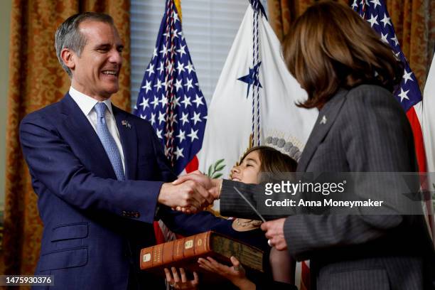 Vice President Kamala Harris shakes hands with Eric Garcetti after his swearing in ceremony as Ambassador to India at the Eisenhower Executive Office...