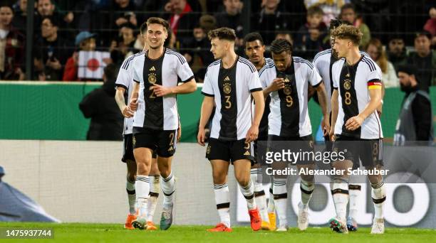 Jessic Ngankam of Germany celebrates his side's first goal with his teammates during the Under-21 friendly match between Germany and Japan at PSD...