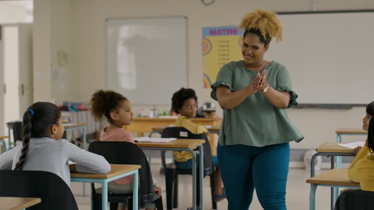 https://media.gettyimages.com/id/1475943601/video/teacher-high-five-children-in-classroom-for-learning-success-education-and-teaching.jpg?b=1&s=640x640&k=20&c=YF5WYtH3EFrJaF_JWO4_CoHRZhcno5earIkyIkyx4js=