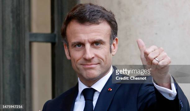 French President Emmanuel Macron waves to media as he welcomes Costa Rica's President Rodrigo Chaves Robles prior to a working dinner at the Elysee...